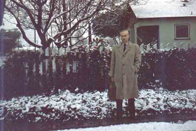 Pappy by the driveway in the snow, 1956